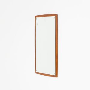 Mid-Century wall mirror by Ølholm Møbelfabrik (Denmark, 1960s). A very elegant wall mirror with a sculptural and detailed appearance, made out of solid teak. In good vintage condition. The glass shows some age related marks.