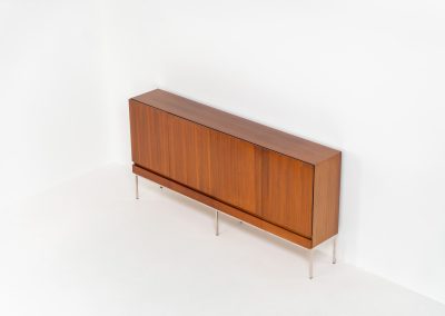 Iconic B60 sideboard in rosewood by Dieter Waeckerlin for Behr (Germany, 1950s). This highly sought after and significant “B60” sideboard is a masterful blend of minimalistic design and functional elegance. It’s unbelievable this piece was made in the 50’s and is yet so timeless. It contains four drawers and four doors with a minimal gap between them. The inside offers lots of storage space with adjustable shelves. It is in amazing condition with minimal sings of use and age.