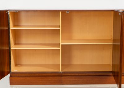 Iconic B60 sideboard in rosewood by Dieter Waeckerlin for Behr (Germany, 1950s). This highly sought after and significant “B60” sideboard is a masterful blend of minimalistic design and functional elegance. It’s unbelievable this piece was made in the 50’s and is yet so timeless. It contains four drawers and four doors with a minimal gap between them. The inside offers lots of storage space with adjustable shelves. It is in amazing condition with minimal sings of use and age.