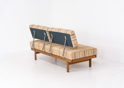 Lovely “Stella” daybed by Wilhelm Knoll (Germany, 1960s). A wonderful piece designed by the renowned Wilhelm Knoll. It features a beech wood frame, chrome backrest-supports and very comfortable cushions with the original striped upholstery. It is easily converted into a daybed just by twisting the seats. In very good vintage condition, with some light signs of use to the fabric.