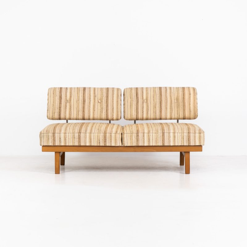 Lovely “Stella” daybed by Wilhelm Knoll (Germany, 1960s). A wonderful piece designed by the renowned Wilhelm Knoll. It features a beech wood frame, chrome backrest-supports and very comfortable cushions with the original striped upholstery. It is easily converted into a daybed just by twisting the seats. In very good vintage condition, with some light signs of use to the fabric.