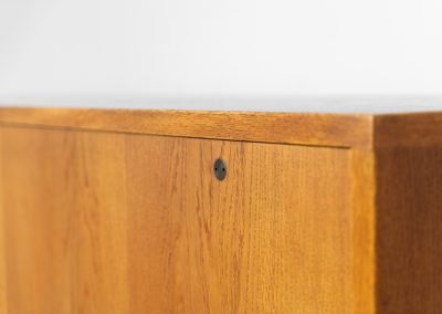 Rare and important RY26 sideboard by Hans J. Wegner for Ry Møbler (Denmark, 1950s). This incredible piece is composed of delicately grained oak with a stunning honey hued stain. It contains two large sliding doors with round inset handles, adjustable shelves and four modular drawers on the inside. This hard to find piece remains in very good vintage condition. It is designed by the the renowned Hans J. Wegner who won multiple awards and honors throughout his carreer.