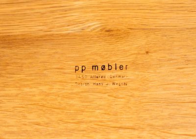 Oak coffee table by Hans J. Wegner for PP Møbler (Denmark, 1960s). A gorgeous round coffee table composed of solid oak with a warm honey hue. It is stamped by maker and remains in very good condition.