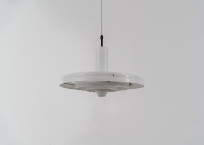 “Fibonacci” pendant light by Sophus Frandsen for Fog & Mørup (Denmark, 1960s). The Fibonacci lamp uses a gravity-guided sliding dip mechanism: the shade glides along the rail and naturally ‘dips’ into position, allowing effortless adjustment of light direction and intensity, a hallmark of Sophus Frandsen’s engineering-minded approach to lighting. The lamp is in amazing vintage condition with minor age related marks. Marked by maker.