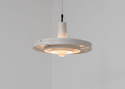 “Fibonacci” pendant light by Sophus Frandsen for Fog & Mørup (Denmark, 1960s). The Fibonacci lamp uses a gravity-guided sliding dip mechanism: the shade glides along the rail and naturally ‘dips’ into position, allowing effortless adjustment of light direction and intensity, a hallmark of Sophus Frandsen’s engineering-minded approach to lighting. The lamp is in amazing vintage condition with minor age related marks. Marked by maker.