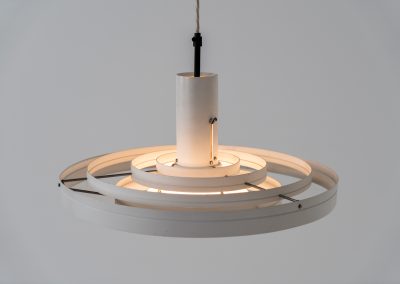 “Fibonacci” pendant light by Sophus Frandsen for Fog & Mørup (Denmark, 1960s). The Fibonacci lamp uses a gravity-guided sliding dip mechanism: the shade glides along the rail and naturally ‘dips’ into position, allowing effortless adjustment of light direction and intensity, a hallmark of Sophus Frandsen’s engineering-minded approach to lighting. The lamp is in amazing vintage condition with minor age related marks. Marked by maker.