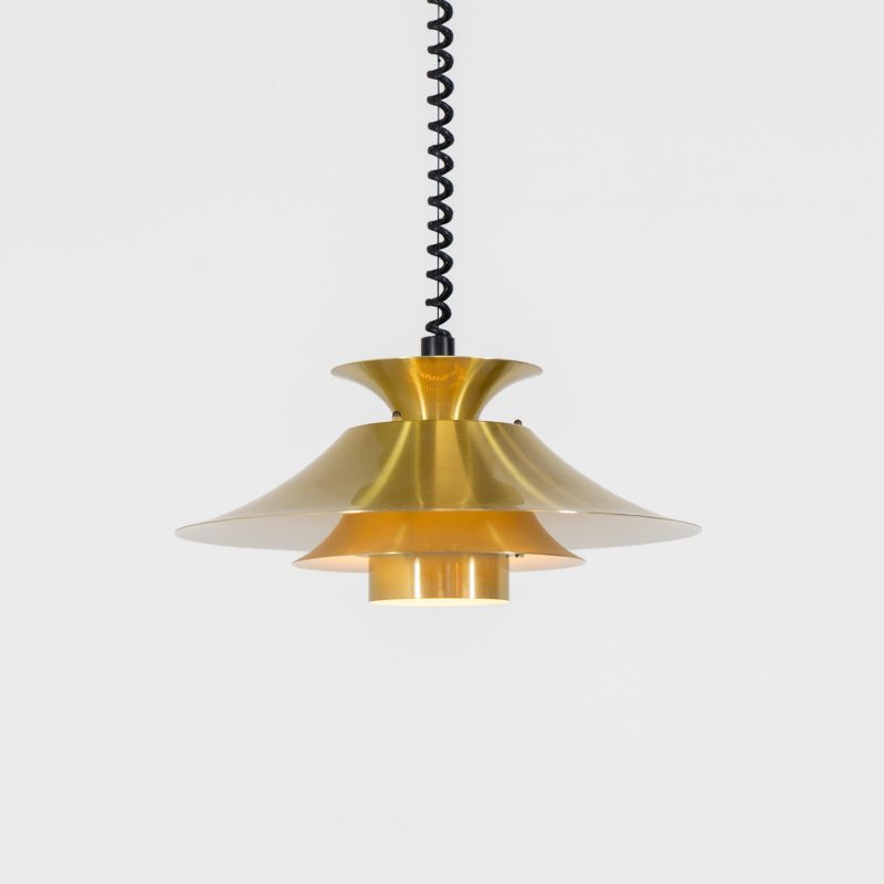 Brass colored pendant light by Frandsen (Denmark, 1970s). A beautiful lamp made out of four aluminium shades with a brass colored exterior. Featuring the original height-adjustable cord. The lamp remains in splendid condition.