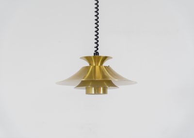 Brass colored pendant light by Frandsen (Denmark, 1970s). A beautiful lamp made out of four aluminium shades with a brass colored exterior. Featuring the original height-adjustable cord. The lamp remains in splendid condition.