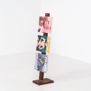 Vintage magazine holder in solid teak (Denmark, 1960s). This rarely seen item features a compact and clean vertical design, made to showcase slim books or magazines. It’s crafted with solid teak and chromed metal supports & joinery. In very good condition.