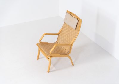 Albert chair by Finn Ostergaard for Skipper (Denmark, 1970s). A beautiful and sculptural armchair that consists of a beech bentwood frame, a woven canvas-strap webbing and an adjustable canvas headrest, finished with leather details. In good condition with a nice patina on the straps & canvas.