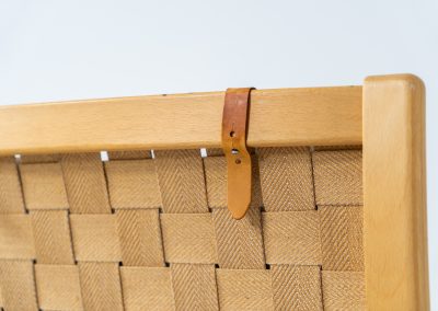Albert chair by Finn Ostergaard for Skipper (Denmark, 1970s). A beautiful and sculptural armchair that consists of a beech bentwood frame, a woven canvas-strap webbing and an adjustable canvas headrest, finished with leather details. In good condition with a nice patina on the straps & canvas.