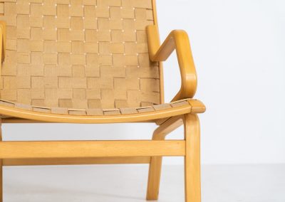 Albert chair by Finn Ostergaard for Skipper (Denmark, 1970s). A beautiful and sculptural armchair that consists of a beech bentwood frame, a woven canvas-strap webbing and an adjustable canvas headrest, finished with leather details. In good condition with a nice patina on the straps & canvas.