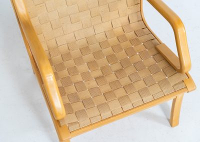 Albert chair by Finn Ostergaard for Skipper (Denmark, 1970s). A beautiful and sculptural armchair that consists of a beech bentwood frame, a woven canvas-strap webbing and an adjustable canvas headrest, finished with leather details. In good condition with a nice patina on the straps & canvas.
