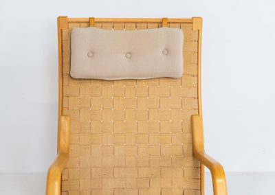 Albert chair by Finn Ostergaard for Skipper (Denmark, 1970s). A beautiful and sculptural armchair that consists of a beech bentwood frame, a woven canvas-strap webbing and an adjustable canvas headrest, finished with leather details. In good condition with a nice patina on the straps & canvas.