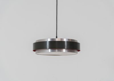 “Sera” pendant light by Jo Hammerborg for Fog & Mørup (Denmark, 1960s). A wonderful example of Danish modernism! This Sera pendel has a sleek, timeless and stunning appearance. Crafted with two brushed aluminium shades, a black lacquered halo and an acrylic light diffuser. The inside of the halo is lacquered in pink, which gives that extra dimension in the light dispersion when turned on. The lamp is in very good vintage condition!