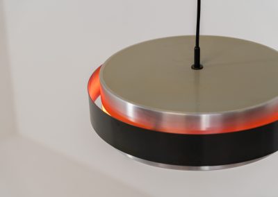 “Sera” pendant light by Jo Hammerborg for Fog & Mørup (Denmark, 1960s). A wonderful example of Danish modernism! This Sera pendel has a sleek, timeless and stunning appearance. Crafted with two brushed aluminium shades, a black lacquered halo and an acrylic light diffuser. The inside of the halo is lacquered in pink, which gives that extra dimension in the light dispersion when turned on. The lamp is in very good vintage condition!