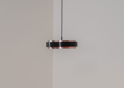 “Sera” pendant light by Jo Hammerborg for Fog & Mørup (Denmark, 1960s). A wonderful example of Danish modernism! This Sera pendel has a sleek, timeless and stunning appearance. Crafted with two brushed aluminium shades, a black lacquered halo and an acrylic light diffuser. The inside of the halo is lacquered in pink, which gives that extra dimension in the light dispersion when turned on. The lamp is in very good vintage condition!