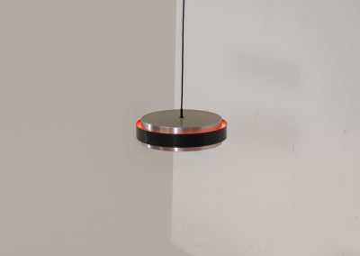 “Sera” pendant light by Jo Hammerborg for Fog & Mørup (Denmark, 1960s). A wonderful example of Danish modernism! This Sera pendel has a sleek, timeless and stunning appearance. Crafted with two brushed aluminium shades, a black lacquered halo and an acrylic light diffuser. The inside of the halo is lacquered in pink, which gives that extra dimension in the light dispersion when turned on. The lamp is in very good vintage condition!