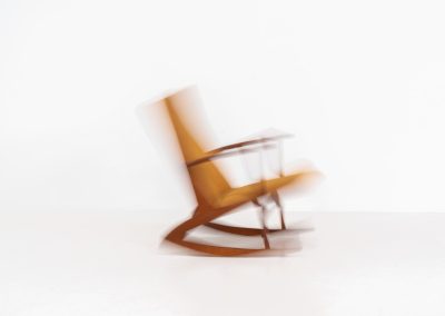 Stunning rocking chair by Georg Jensen for Kubus (Denmark, 1950s). This exceptional piece features a solid teak frame with beautiful organic lines and cushions that were recently reupholstered in an ocher yellow fabric. The chair is very comfortable, highly detailed and extremely beautiful.