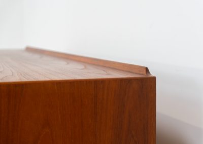 Rare “OS29” sideboard by Arne Vodder for Sibast (Denmark, 1950s). This highly important and collectible masterpiece by Arne Vodder is a rarity to find in good condition. The OS29 has perfect proportions, beautiful aesthetics and a high quality finish. It is crafted out of teak and features a turnable black door, 5 bow tie shaped drawers, adjustable shelves and a raised back edge. This piece remains in very good condition with a few small repair marks and using traces, as shown on the pictures. It is marked and stamped by the maker.