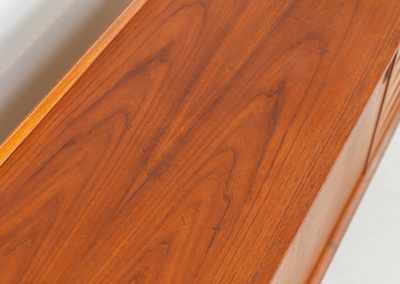 Rare “OS29” sideboard by Arne Vodder for Sibast (Denmark, 1950s). This highly important and collectible masterpiece by Arne Vodder is a rarity to find in good condition. The OS29 has perfect proportions, beautiful aesthetics and a high quality finish. It is crafted out of teak and features a turnable black door, 5 bow tie shaped drawers, adjustable shelves and a raised back edge. This piece remains in very good condition with a few small repair marks and using traces, as shown on the pictures. It is marked and stamped by the maker.