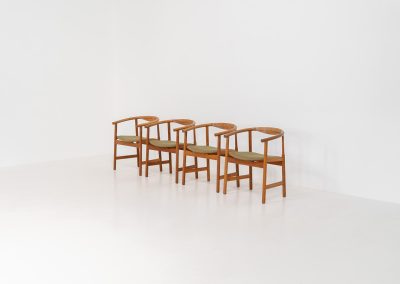 Set of 4 “PP203” arm chairs by Hans J. Wegner for PP Møbler (Denmark, 1960s). The PP203 chair, also called “First Chair” is an iconic design by the renowned Hans Wegner and is crafted out of solid oak and highly detailed wengé joinery. These beauties are in very good condition, have the original green upholstery and are marked by maker.