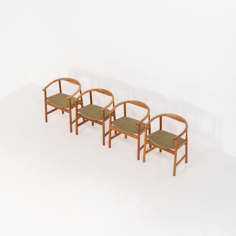 Set of 4 “PP203” arm chairs by Hans J. Wegner for PP Møbler (Denmark, 1960s). The PP203 chair, also called “First Chair” is an iconic design by the renowned Hans Wegner and is crafted out of solid oak and highly detailed wengé joinery. These beauties are in very good condition, have the original green upholstery and are marked by maker.