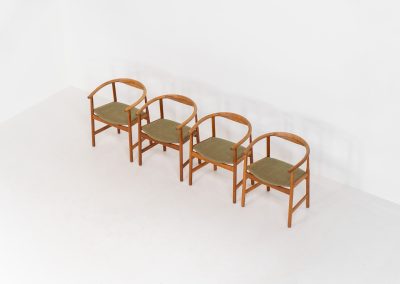 Set of 4 “PP203” arm chairs by Hans J. Wegner for PP Møbler (Denmark, 1960s). The PP203 chair, also called “First Chair” is an iconic design by the renowned Hans Wegner and is crafted out of solid oak and highly detailed wengé joinery. These beauties are in very good condition, have the original green upholstery and are marked by maker.