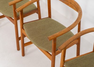 Set of 4 “PP203” arm chairs by Hans J. Wegner for PP Møbler (Denmark, 1960s). The PP203 chair, also called “First Chair” is an iconic design by the renowned Hans Wegner and is crafted out of solid oak and highly detailed wengé joinery. These beauties are in very good condition, have the original green upholstery and are marked by maker.