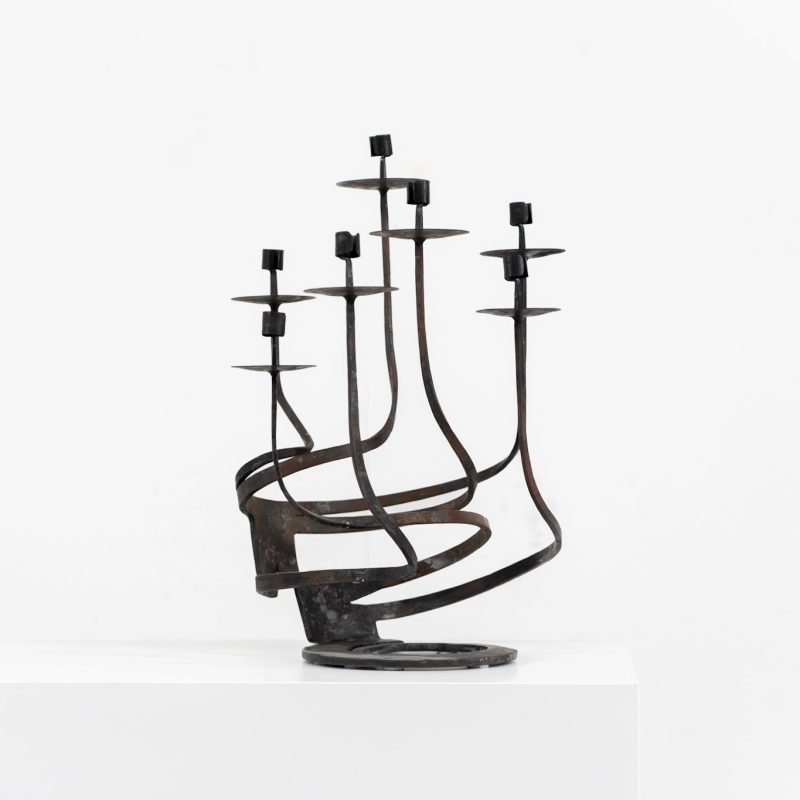 Stunning brutalist candelabra in the manner of Jean Touret for Arelier Marolles (France, 1950s). A highly sculptural cast iron candelabra featuring seven candle holders and a stunning patina.