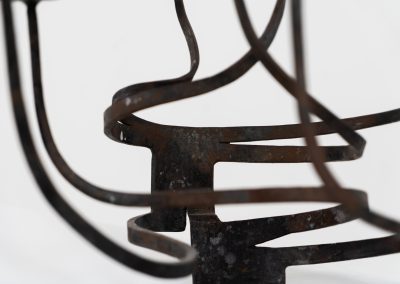 Stunning brutalist candelabra in the manner of Jean Touret for Arelier Marolles (France, 1950s). A highly sculptural cast iron candelabra featuring seven candle holders and a stunning patina.