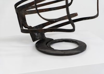 Stunning brutalist candelabra in the manner of Jean Touret for Arelier Marolles (France, 1950s). A highly sculptural cast iron candelabra featuring seven candle holders and a stunning patina.