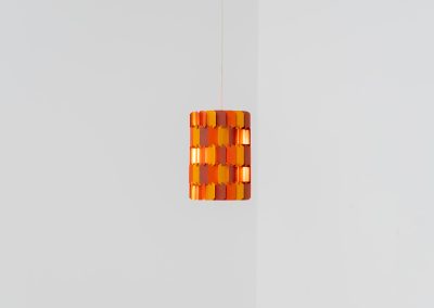 “Facet Pop” pendant light by Louis Weisdorf for Lyfa (Denmark, 1960s). A striking and highly sculptural pendant light designed by Louis Weisdorf for Lyfa in the 1960s. The lamp is constructed from multiple interlocking metal panels, lacquered in three vibrant colours, creating a dynamic play of light and shadow. Due to its complex and costly production process, this model was manufactured for only a short period, making it a rare and sought-after design today. An exceptional and colourful eye-catcher in very good condition. Marked by the manufacturer and newly rewired.