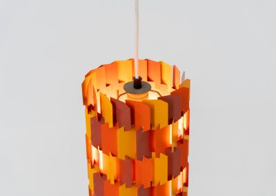 “Facet Pop” pendant light by Louis Weisdorf for Lyfa (Denmark, 1960s). A striking and highly sculptural pendant light designed by Louis Weisdorf for Lyfa in the 1960s. The lamp is constructed from multiple interlocking metal panels, lacquered in three vibrant colours, creating a dynamic play of light and shadow. Due to its complex and costly production process, this model was manufactured for only a short period, making it a rare and sought-after design today. An exceptional and colourful eye-catcher in very good condition. Marked by the manufacturer and newly rewired.