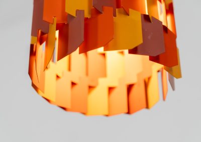 “Facet Pop” pendant light by Louis Weisdorf for Lyfa (Denmark, 1960s). A striking and highly sculptural pendant light designed by Louis Weisdorf for Lyfa in the 1960s. The lamp is constructed from multiple interlocking metal panels, lacquered in three vibrant colours, creating a dynamic play of light and shadow. Due to its complex and costly production process, this model was manufactured for only a short period, making it a rare and sought-after design today. An exceptional and colourful eye-catcher in very good condition. Marked by the manufacturer and newly rewired.