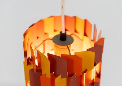 “Facet Pop” pendant light by Louis Weisdorf for Lyfa (Denmark, 1960s). A striking and highly sculptural pendant light designed by Louis Weisdorf for Lyfa in the 1960s. The lamp is constructed from multiple interlocking metal panels, lacquered in three vibrant colours, creating a dynamic play of light and shadow. Due to its complex and costly production process, this model was manufactured for only a short period, making it a rare and sought-after design today. An exceptional and colourful eye-catcher in very good condition. Marked by the manufacturer and newly rewired.