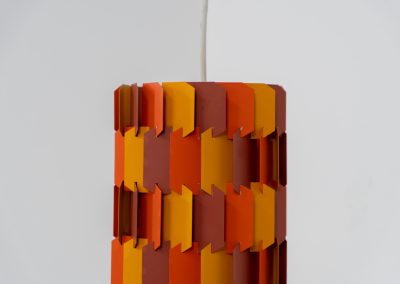 “Facet Pop” pendant light by Louis Weisdorf for Lyfa (Denmark, 1960s). A striking and highly sculptural pendant light designed by Louis Weisdorf for Lyfa in the 1960s. The lamp is constructed from multiple interlocking metal panels, lacquered in three vibrant colours, creating a dynamic play of light and shadow. Due to its complex and costly production process, this model was manufactured for only a short period, making it a rare and sought-after design today. An exceptional and colourful eye-catcher in very good condition. Marked by the manufacturer and newly rewired.