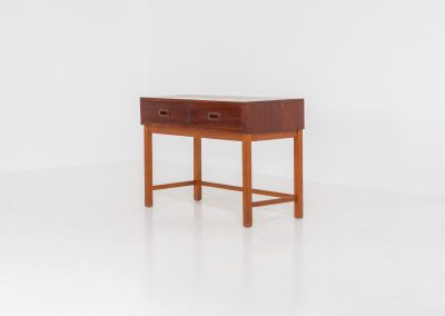 Teak hallway cabinet (Denmark, 1960s). An elegant hallway cabinet in teak, supported by oak legs. Its in good vintage condition with some age related wear.