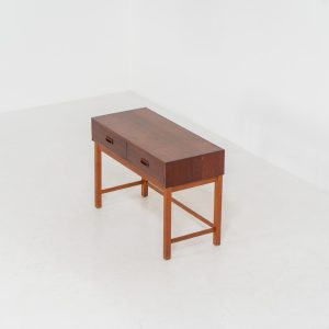 Teak hallway cabinet (Denmark, 1960s). An elegant hallway cabinet in teak, supported by oak legs. Its in good vintage condition with some age related wear.