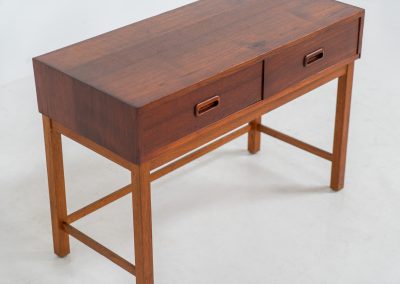 Teak hallway cabinet (Denmark, 1960s). An elegant hallway cabinet in teak, supported by oak legs. Its in good vintage condition with some age related wear.