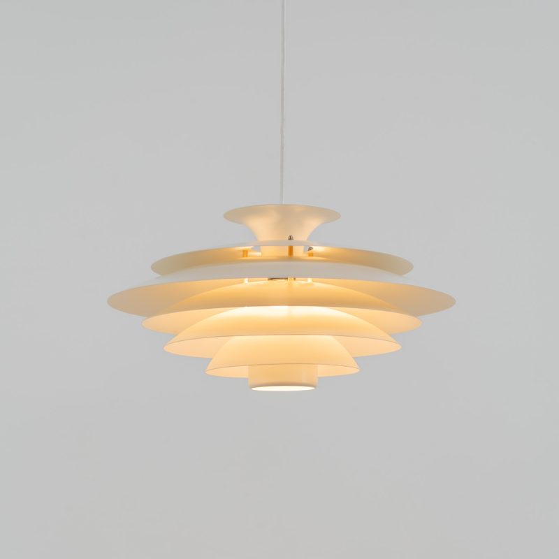 Beautiful “52580” pendant light by Form Light (Denmark, 1970s). The lamp is crafted out of seven metal shades and gives a stunning light dispersion. In mint condition and labeled by maker.