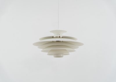 Beautiful “52580” pendant light by Form Light (Denmark, 1970s). The lamp is crafted out of seven metal shades and gives a stunning light dispersion. In mint condition and labeled by maker.