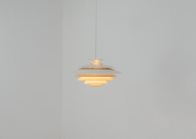 Beautiful “52580” pendant light by Form Light (Denmark, 1970s). The lamp is crafted out of seven metal shades and gives a stunning light dispersion. In mint condition and labeled by maker.