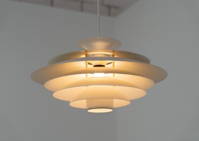 Beautiful “52580” pendant light by Form Light (Denmark, 1970s). The lamp is crafted out of seven metal shades and gives a stunning light dispersion. In mint condition and labeled by maker.