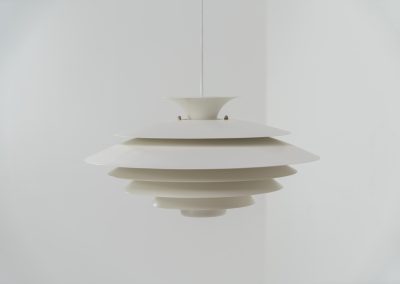 Beautiful “52580” pendant light by Form Light (Denmark, 1970s). The lamp is crafted out of seven metal shades and gives a stunning light dispersion. In mint condition and labeled by maker.