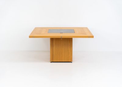 “Cirkante” dining table by Bob & Dries Vanden Berghe for Vanden Berghe Pauvers (Belgium, 1980s). This Belgian icon by Bob Van den Berghe is a masterclass in geometric functionalism. With its signature folding leaves, the Cirkante transforms from a solid square into a spacious octagon, expanding capacity from 8 to 12 people in seconds. By erasing the "head of the table" to put every guest at the center of the conversation. By removing the "head" of the table, its architectural form ensures every guest is at the heart of the conversation. Crafted from premium materials, it remains a timeless sculptural centerpiece for the modern collector. The table remains in amazing condition with minimal wear.