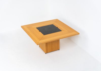 “Cirkante” dining table by Bob & Dries Vanden Berghe for Vanden Berghe Pauvers (Belgium, 1980s). This Belgian icon by Bob Van den Berghe is a masterclass in geometric functionalism. With its signature folding leaves, the Cirkante transforms from a solid square into a spacious octagon, expanding capacity from 8 to 12 people in seconds. By erasing the "head of the table" to put every guest at the center of the conversation. By removing the "head" of the table, its architectural form ensures every guest is at the heart of the conversation. Crafted from premium materials, it remains a timeless sculptural centerpiece for the modern collector. The table remains in amazing condition with minimal wear.