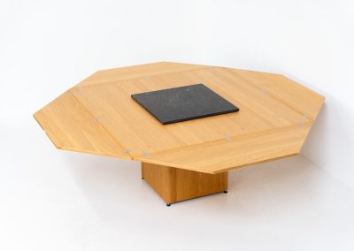 “Cirkante” dining table by Bob & Dries Vanden Berghe for Vanden Berghe Pauvers (Belgium, 1980s). This Belgian icon by Bob Van den Berghe is a masterclass in geometric functionalism. With its signature folding leaves, the Cirkante transforms from a solid square into a spacious octagon, expanding capacity from 8 to 12 people in seconds. By erasing the "head of the table" to put every guest at the center of the conversation. By removing the "head" of the table, its architectural form ensures every guest is at the heart of the conversation. Crafted from premium materials, it remains a timeless sculptural centerpiece for the modern collector. The table remains in amazing condition with minimal wear.