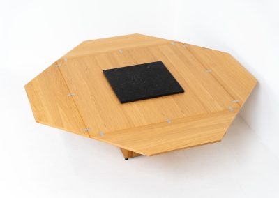 “Cirkante” dining table by Bob & Dries Vanden Berghe for Vanden Berghe Pauvers (Belgium, 1980s). This Belgian icon by Bob Van den Berghe is a masterclass in geometric functionalism. With its signature folding leaves, the Cirkante transforms from a solid square into a spacious octagon, expanding capacity from 8 to 12 people in seconds. By erasing the "head of the table" to put every guest at the center of the conversation. By removing the "head" of the table, its architectural form ensures every guest is at the heart of the conversation. Crafted from premium materials, it remains a timeless sculptural centerpiece for the modern collector. The table remains in amazing condition with minimal wear.