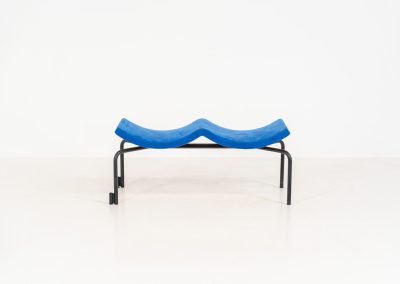 Rare “Sea” bench by Rud Thygesen & Johnny Sørensen for Magnus Olesen (Denmark, 1980s). A beautiful two-seater bench consisting of a black metal frame paired with a wavy seat upholstered in a blue fabric That adds a bold yet refined accent. The bench remains in very good condition and is marked by maker.